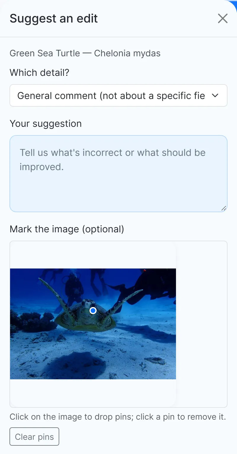 The suggestion window of a species page, with a photo of a green sea turtle on which a pin has been dropped.